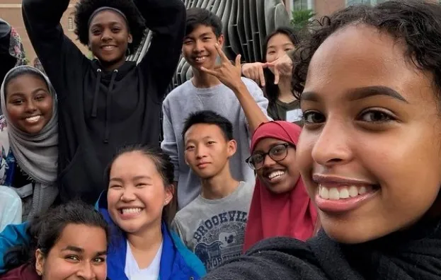 Group of young people smiling into the camera