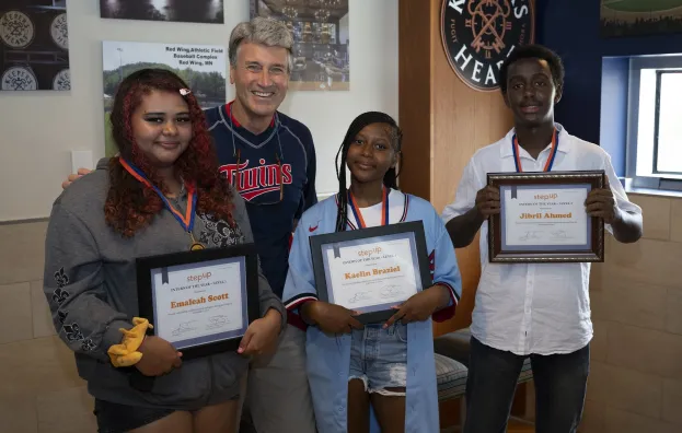 Step Up founder R.T. Rybak with three Step Up intern award winners at public event