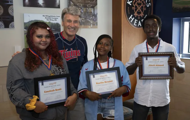 Step Up founder RT Rybak with three interns