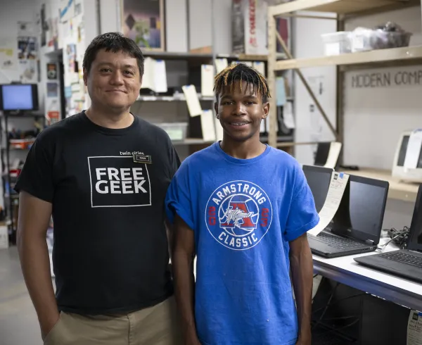 Intern and supervisor smiling at the camera