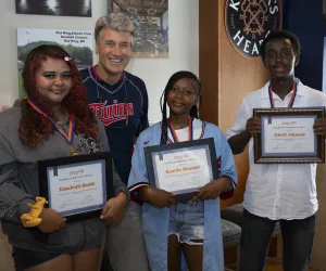 Step Up founder R.T. Rybak with 2024 interns of the year