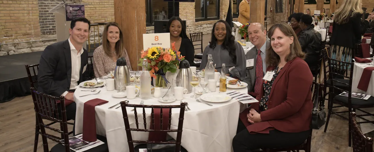 Best Buy guests seated at their table