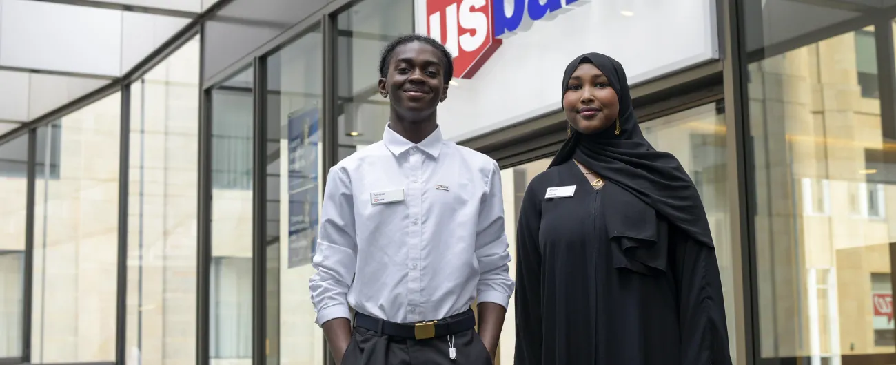 Step Up interns in skyway hallway in front of U.S. Bank sign