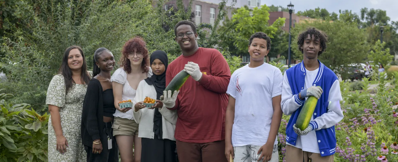 Step Up interns and supervisor standing outside in large garden