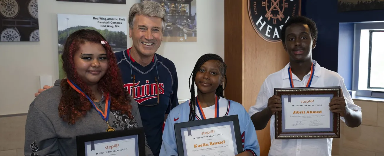 Step Up founder R.T. Rybak with 2024 Step Up Interns of the Year Emaleah, Kaelin and Jibril