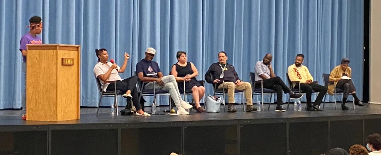 Seven people on career panel sitting on stage