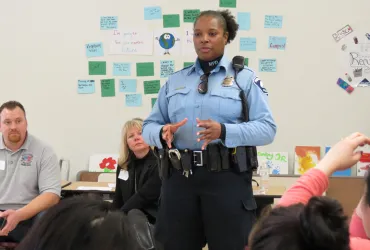 female police officer presenting at career day