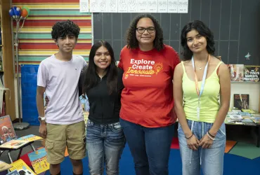 Group of interns with supervisor smiling at camera